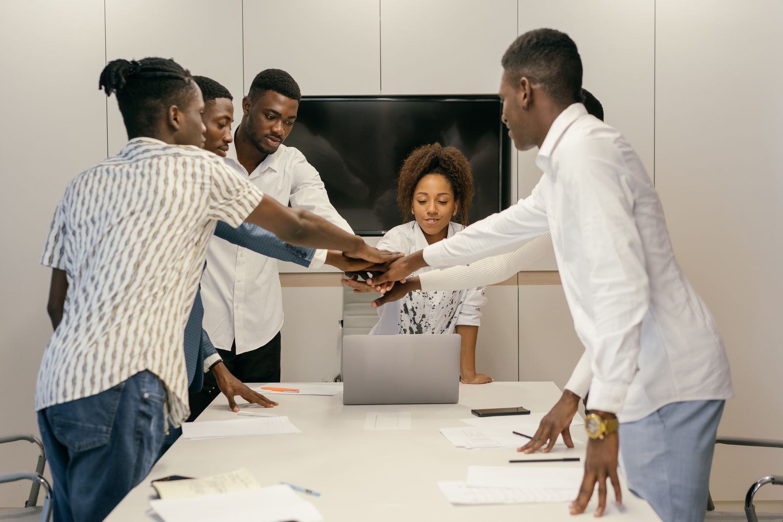A diverse team of professionals celebrating together